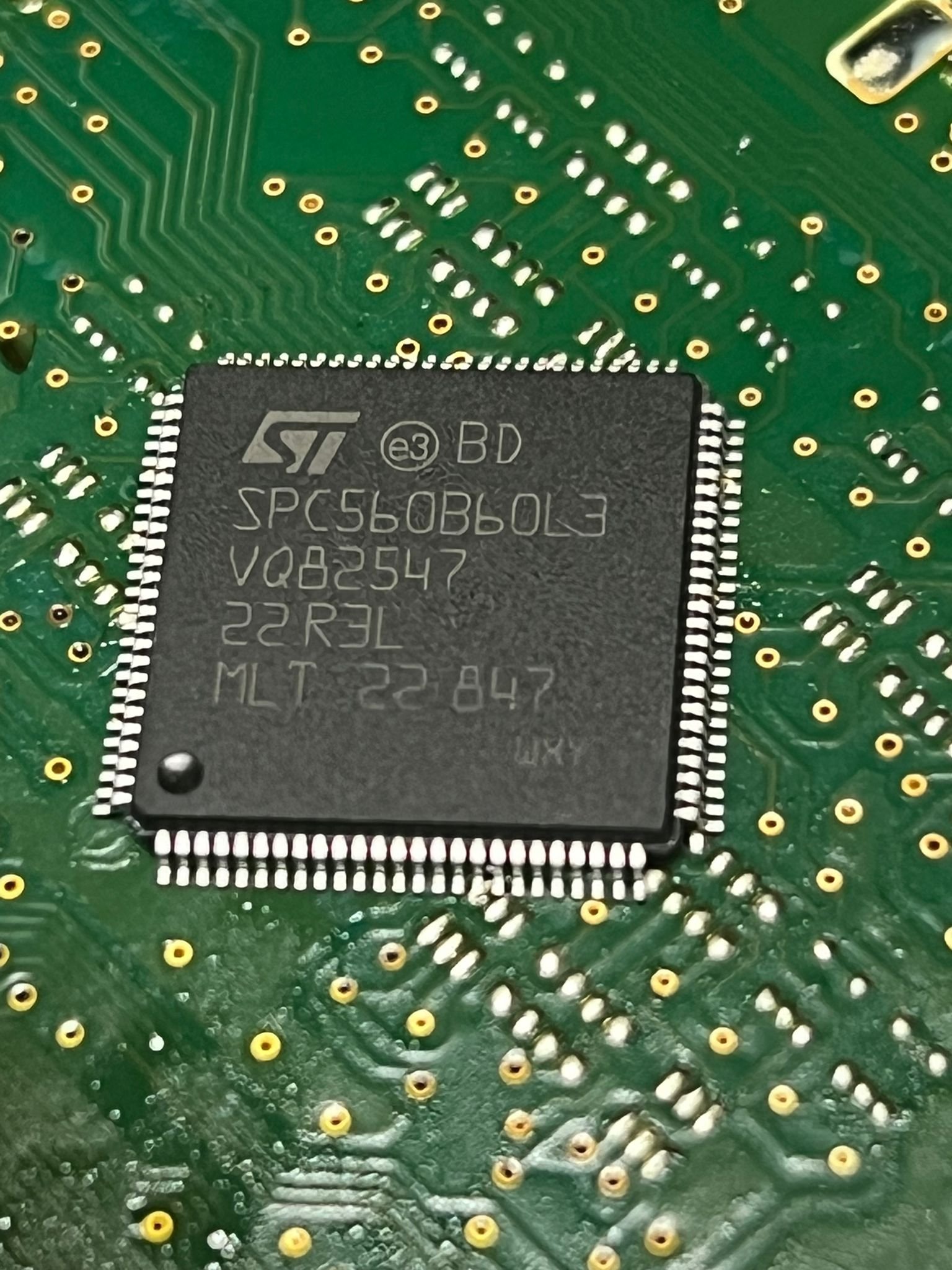 Close-up of SPC560B60L3 chip mounted on a Land Rover KVM control module PCB